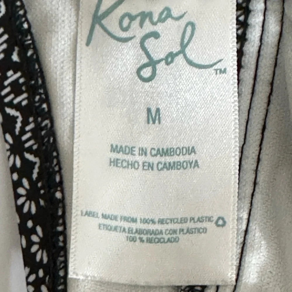 Kona Sol sz med swimsuit in a mini black/white print red print accent on front